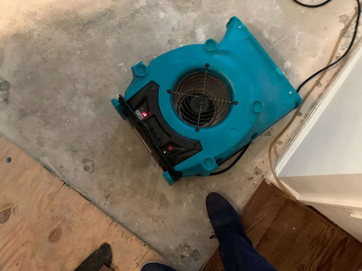 Air mover drying subfloor during Leak Detection & Repair in Leawood